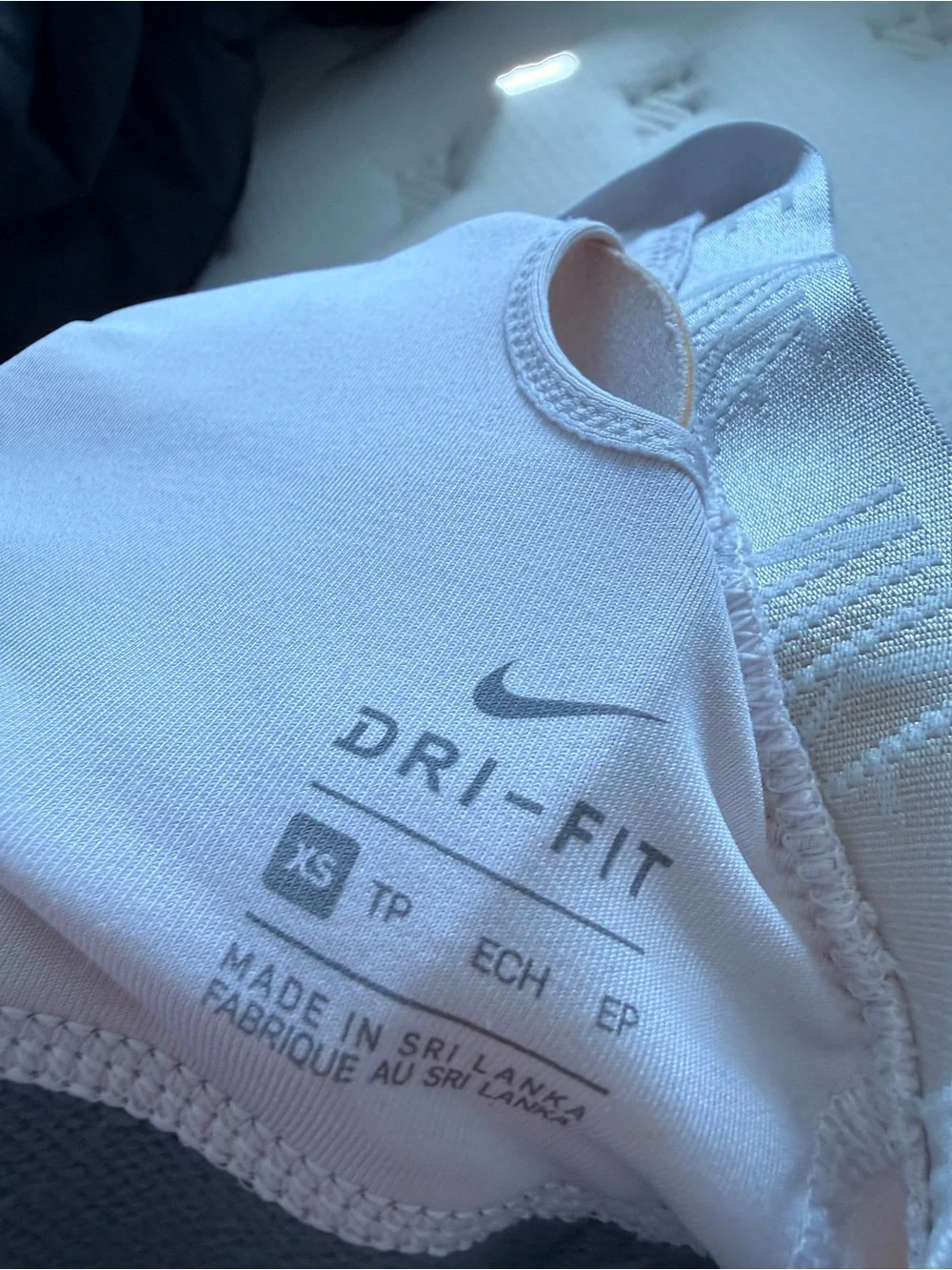 38. Nike Pink and Gray Cross-Back Sports Bra